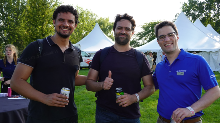 Three men standing next to each other. 