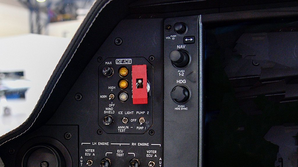 Close-up of a DA62 aircraft's control panel, highlighting the deicing system with multiple lights and buttons for operation.