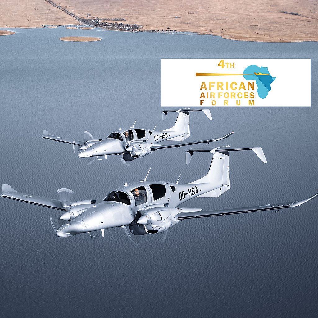 Two DA62 MPP aircraft flying over water. 