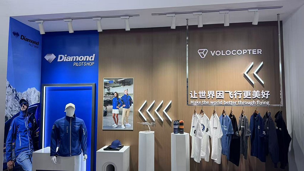 A modern retail display featuring Diamond Pilot Shop branding, showcasing pilot apparel and accessories.