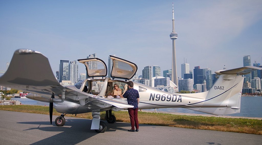 DA62 standing on the ramp with city of Toronto in the background. 