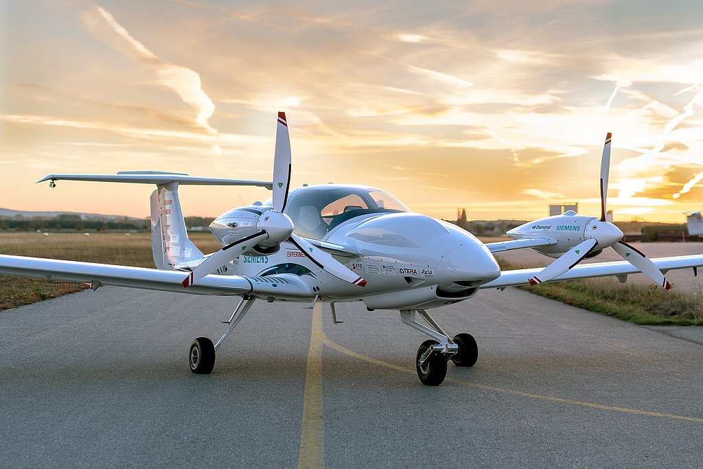 HEMEP aircraft stadinding on the apron during sunset.