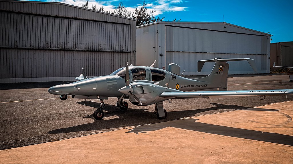 A DA62 MPP aircraft is parked on a tarmac, showcasing its modern design and the 'Jamaica Defence Force' insignia.