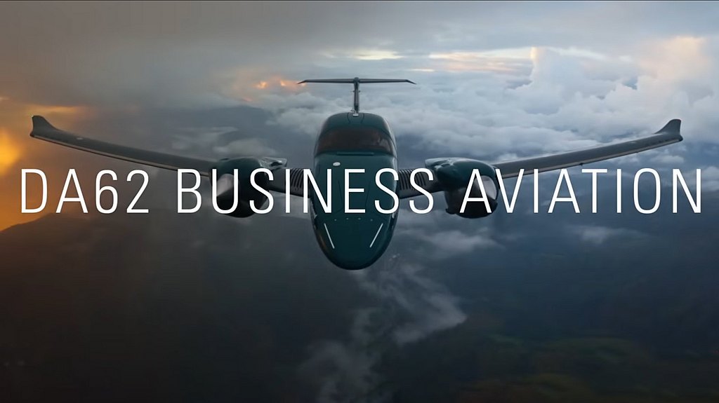 A DA62 aircraft soars through a dramatic sky, showcasing its elegant design against a backdrop of clouds and sunset hues.