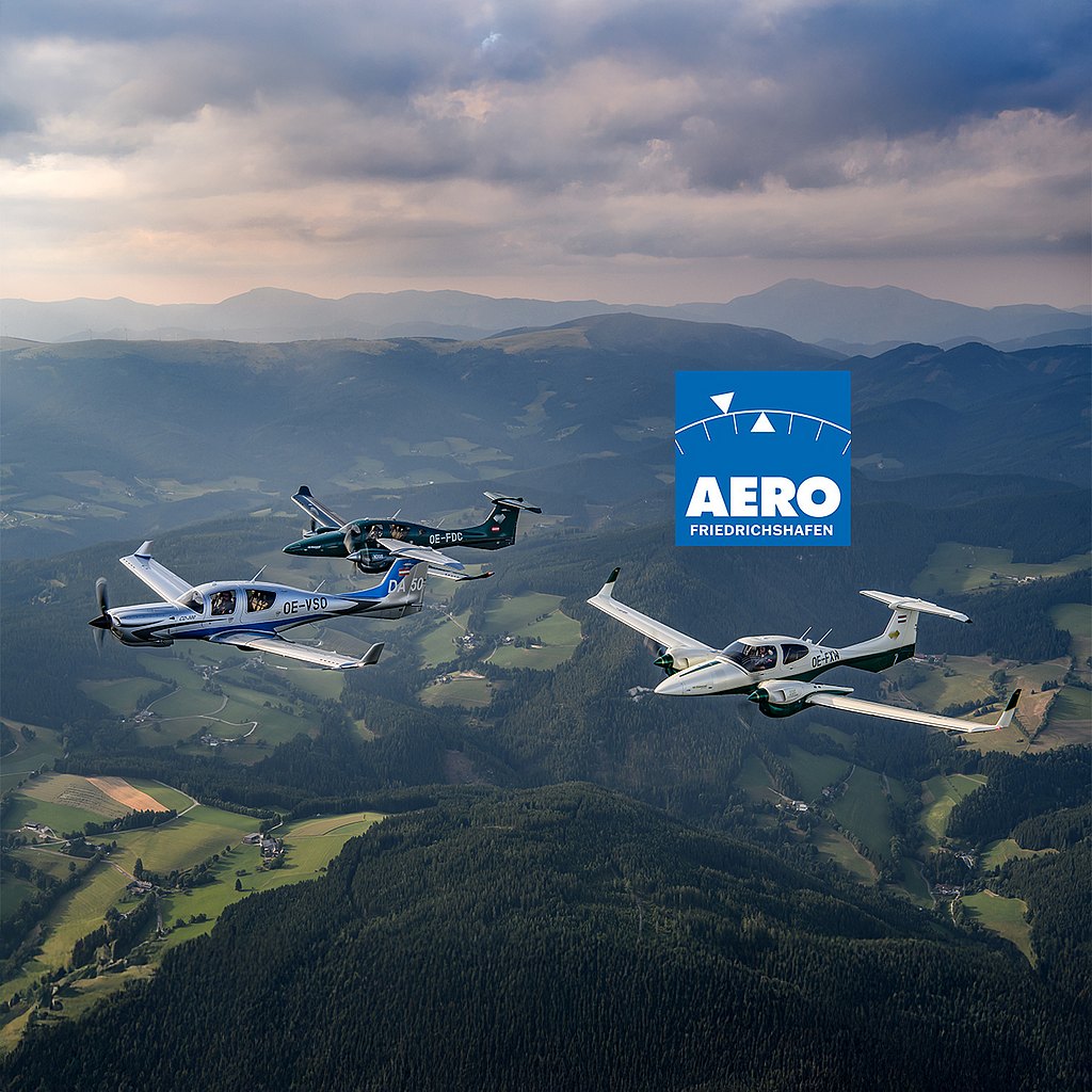 Three Diamond aircraft fly in formation over lush green hills, with a scenic mountainous backdrop and a cloudy sky above.